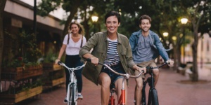 three young friends cycling bikes