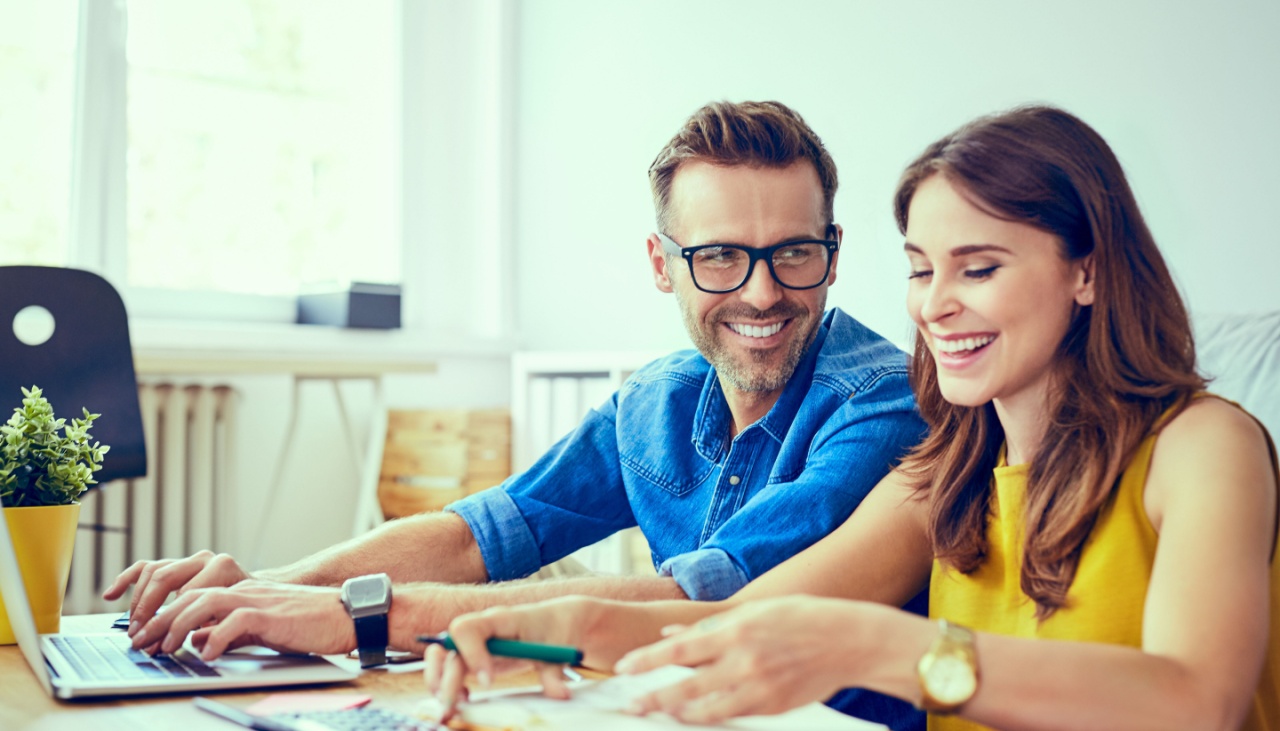 young couple calculating finances at home