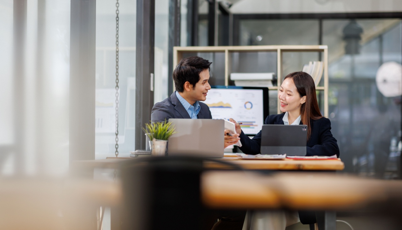 asian male and female colleagues in office