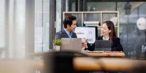 asian male and female colleagues in office