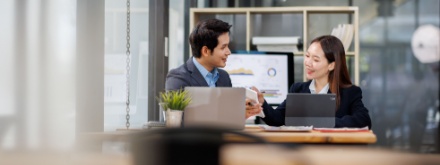 asian male and female colleagues in office
