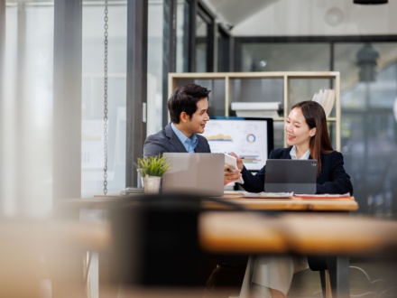 asian male and female colleagues in office
