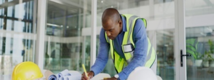 builder drawing on office plans