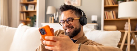 man at home listening to music