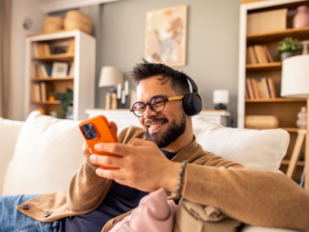 man at home listening to music