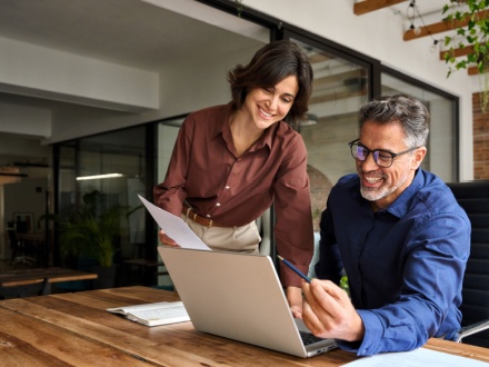 Happy busy executive people working together in office