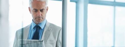 business man reading a newspaper
