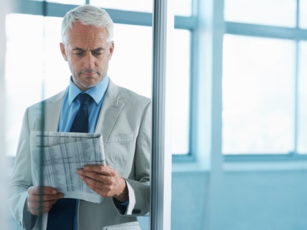 business man reading a newspaper