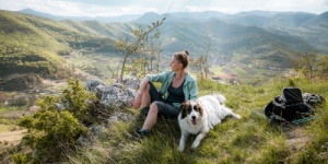 woman in the countryside with her dog