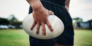 rugby player holding a rugby ball
