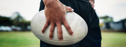 rugby player holding a rugby ball