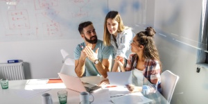 three office staff having a meeting