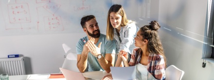 three office staff having a meeting