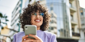 smiling young woman on phone