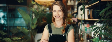 Smiling florist in her flower shop