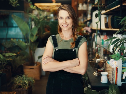 Smiling florist in her flower shop