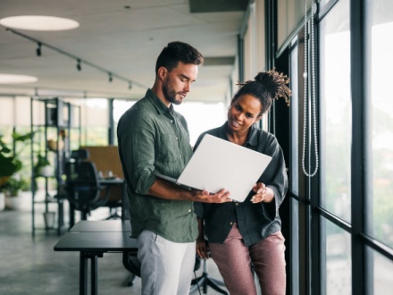 business people working together on laptop computer