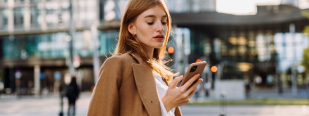 young business woman on phone in the city