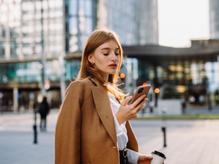 young business woman on phone in the city