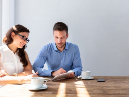 two work colleagues having coffee together