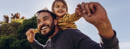 father with child on his shoulders