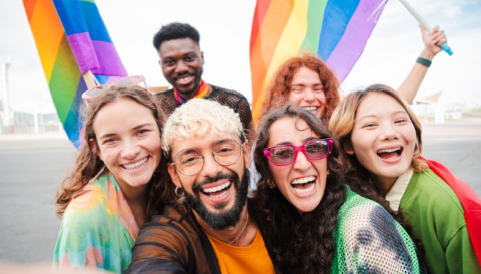 Selfie portrait of a group of lgbt mixed friends celebrating the gay pride parade