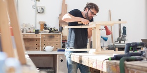 male carpenter working in his workshop