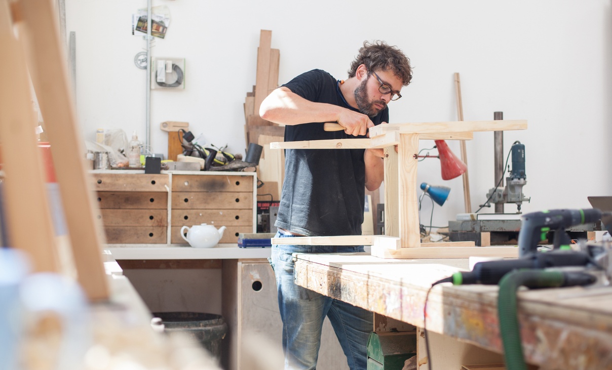 male carpenter working in his workshop