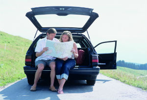 man and woman look at a map
