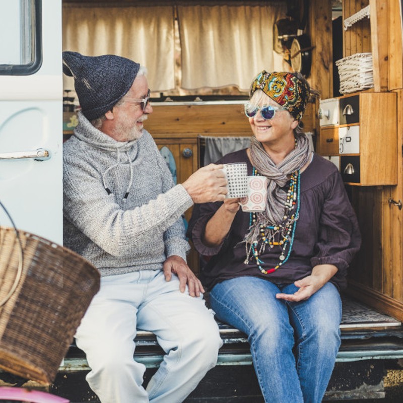 older couple in camper van on road trip