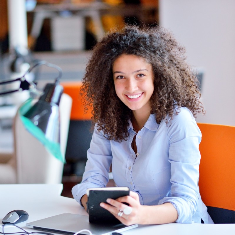 young female worker at desk