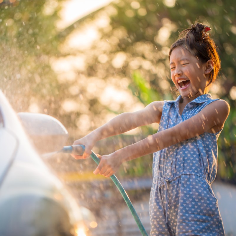 child washing car