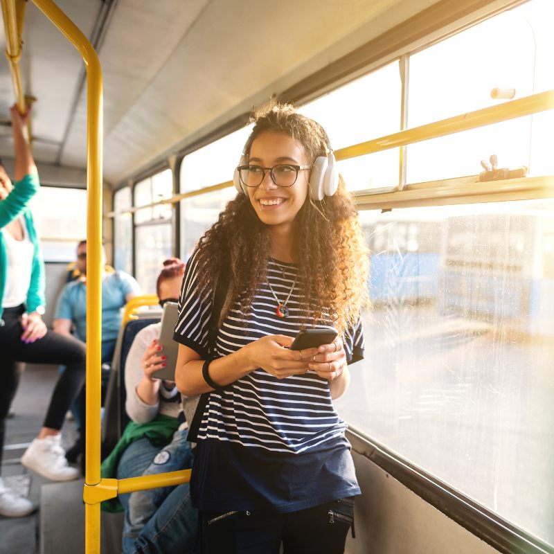 Girl on a bus with her phone