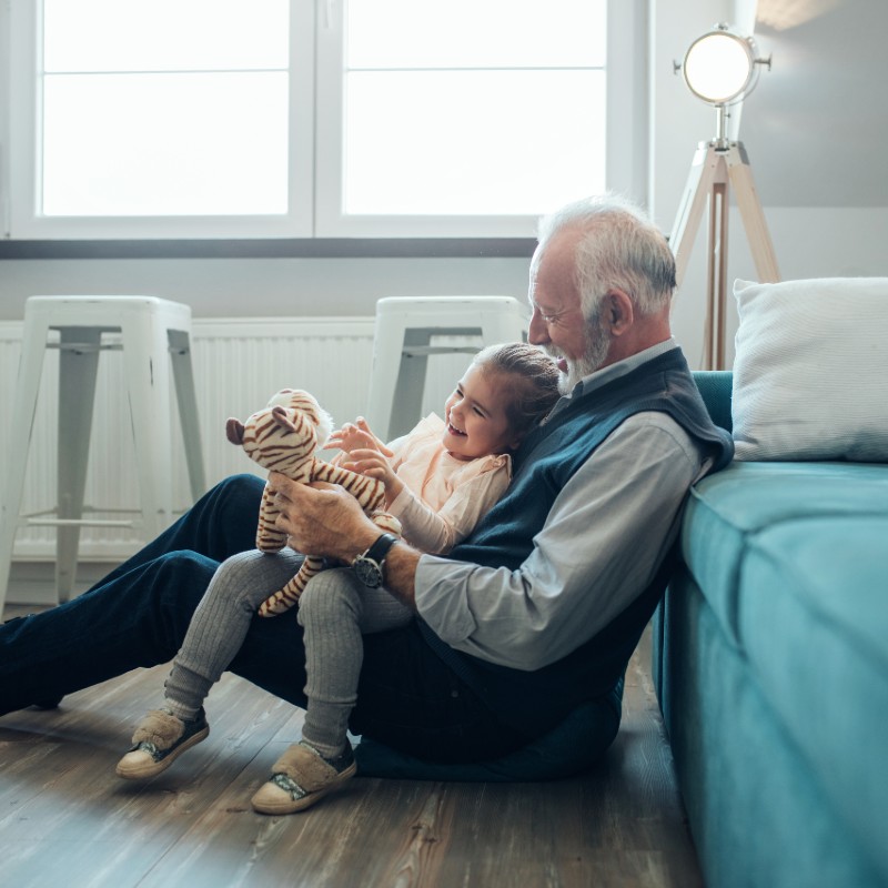 Grandfather playing with young grandaughter