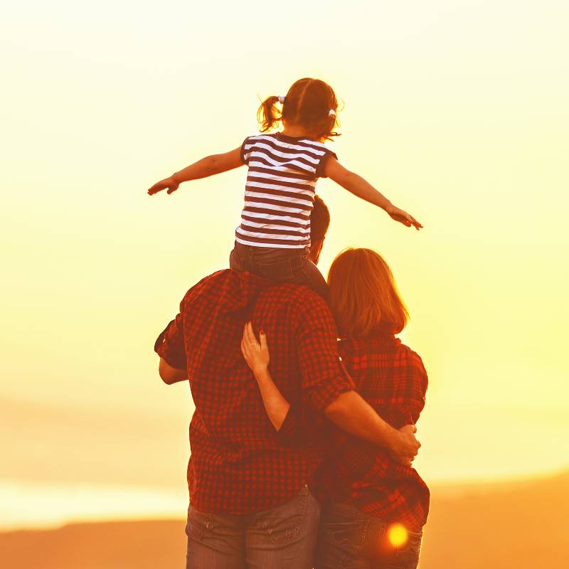 Family watching the sunset