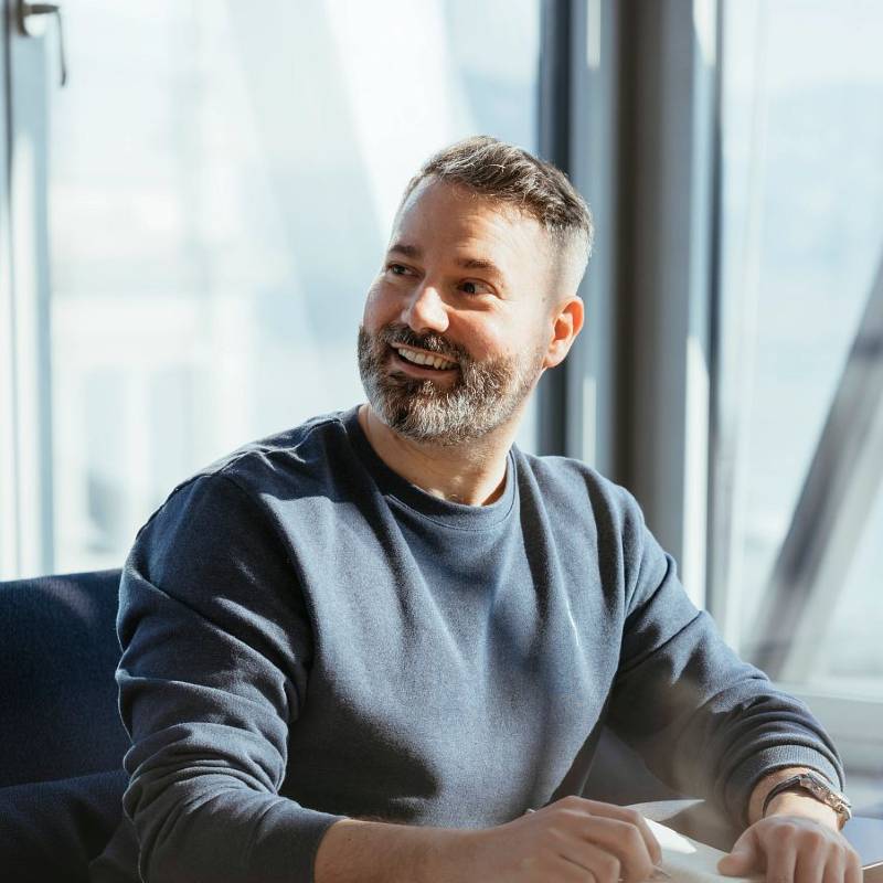 Businessman in casual sweater in modern office