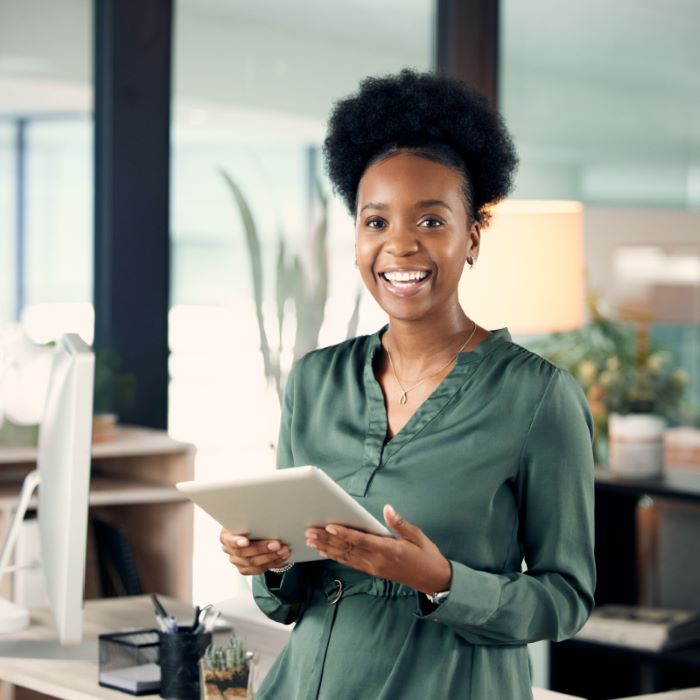 Woman in office on tablet