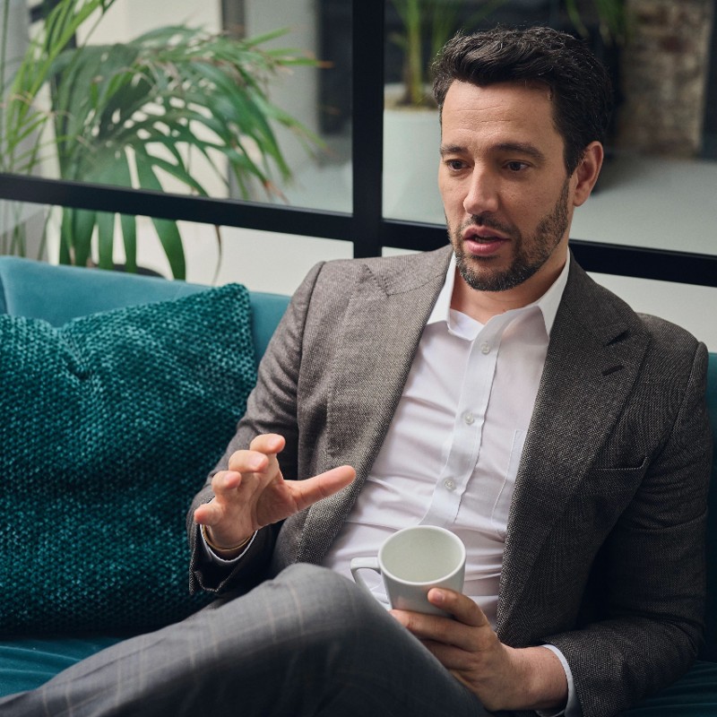 man on couch in office