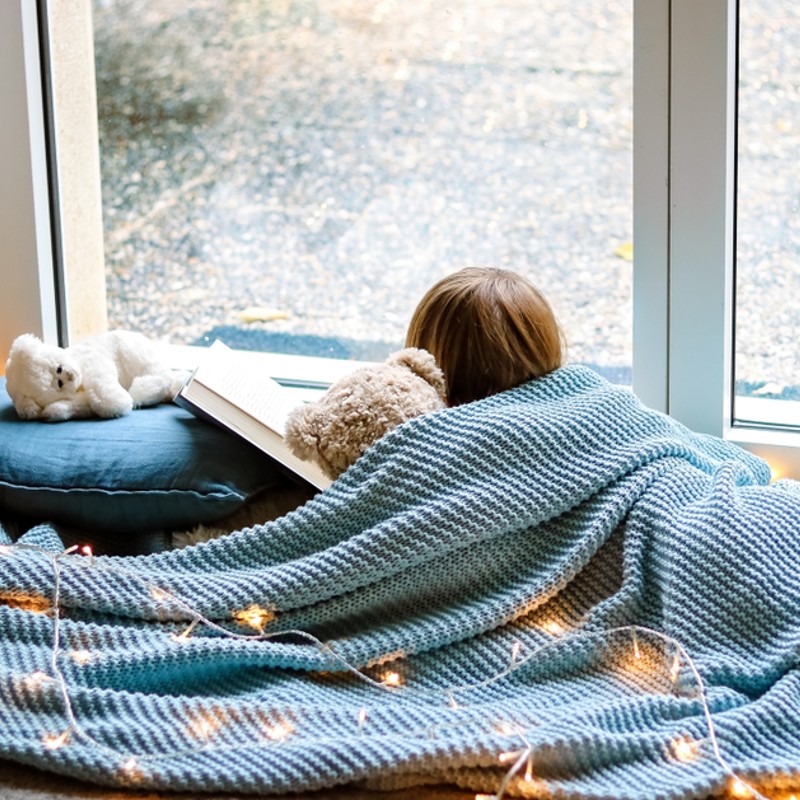 child sleeping with teddy bear