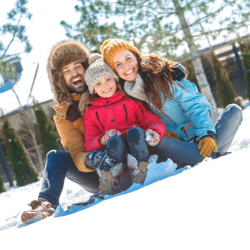 family outside in snow