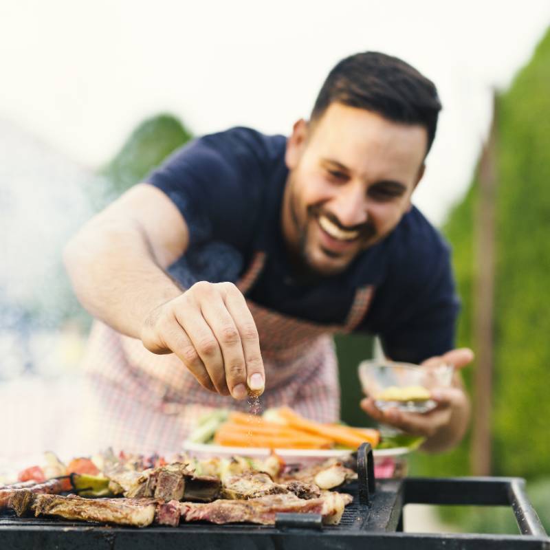 man barbecue in garden