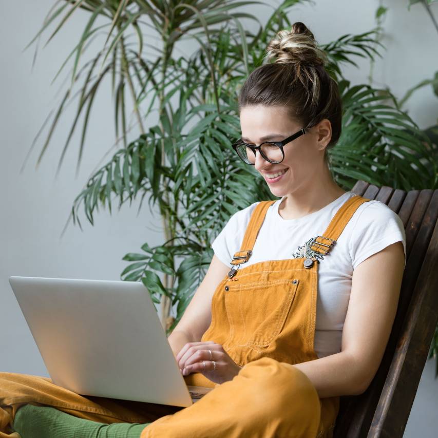 woman on laptop in garden