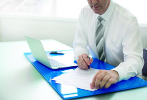300x205 business man at desk 300x205 business man at desk