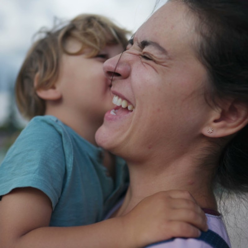 mother holding son in arms