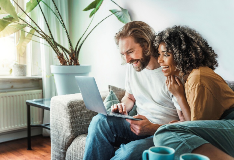 couple at home on tablet