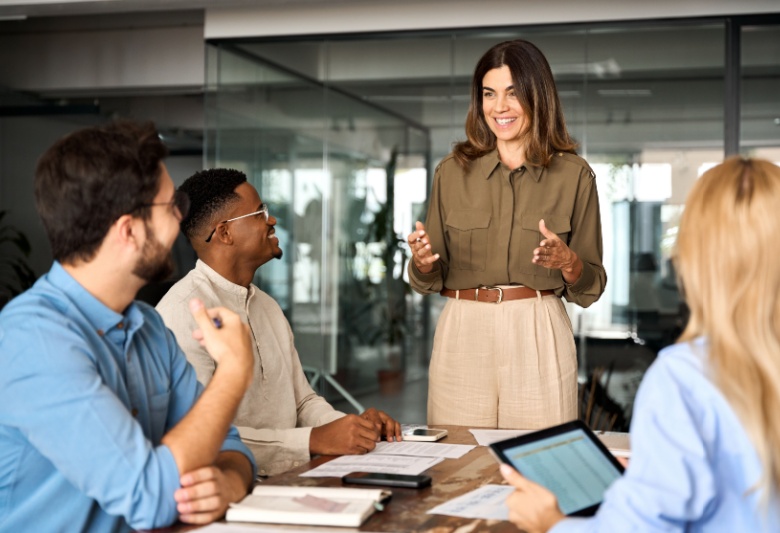 female manager talking to office employees