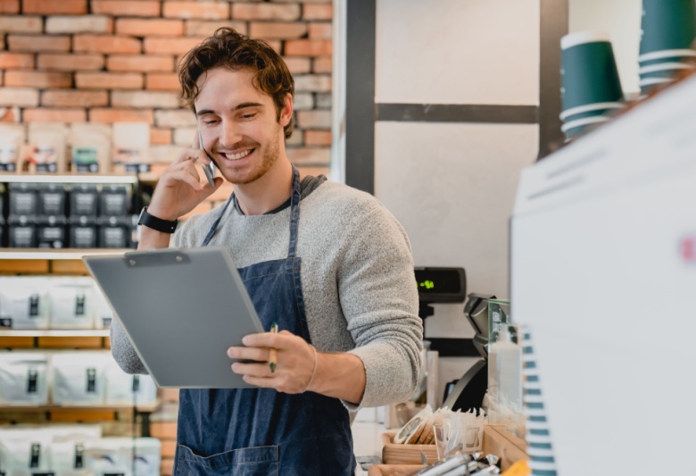 man in coffee shop on phone