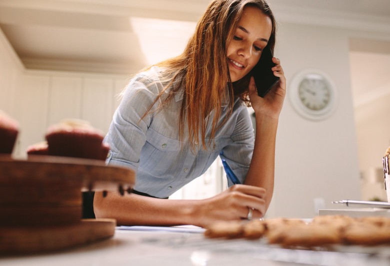 woman baking on phone