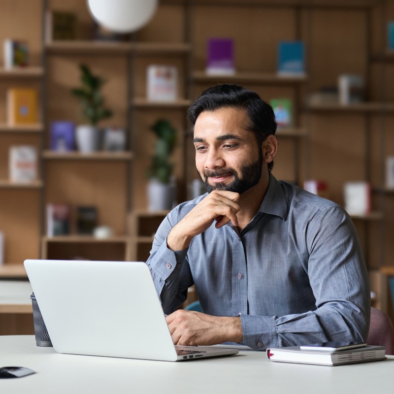 asian man on laptop