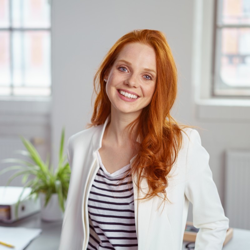 woman in office with red hair